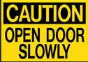 Caution Open Door Slowly Sign